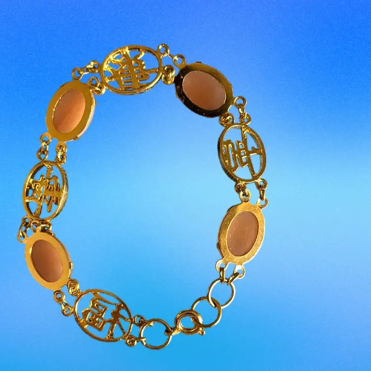 Vintage Peach  Oval Cabochons And Gold Tone Medallions Bracelet.