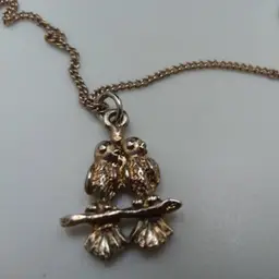 Gold tone Love birds dangle necklace 10"