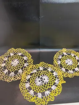 Vintage set of hand crocheted yellow and white doilies