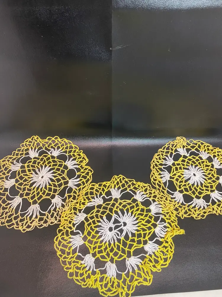 Vintage set of hand crocheted yellow and white doilies
