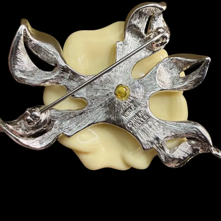 Nolan Miller Lara Camellia white flower and rhinestone pin, part of the Glamour Collection.