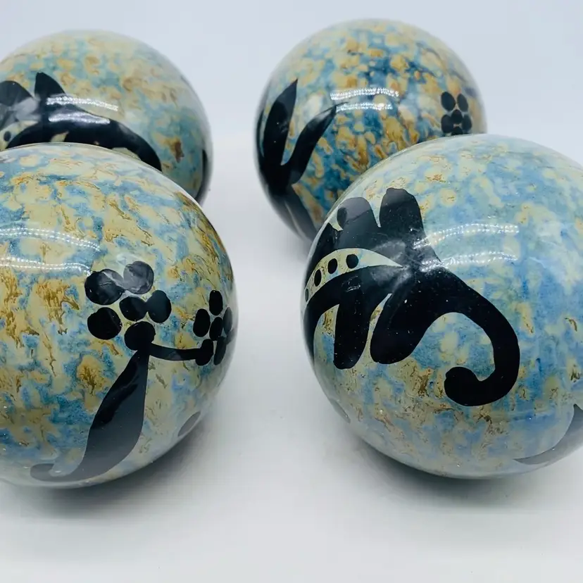 #2234 Set of 4 hand made pottery spheres orbs or carpet bowls .