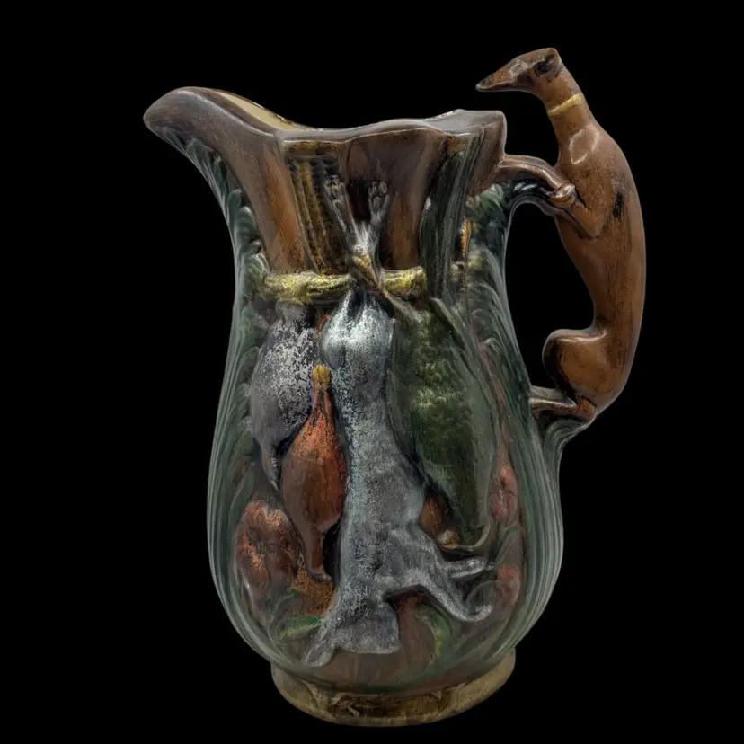 Vintage Majolica-style pitcher with a greyhound handle and hunting game. Stable Crack As Shown