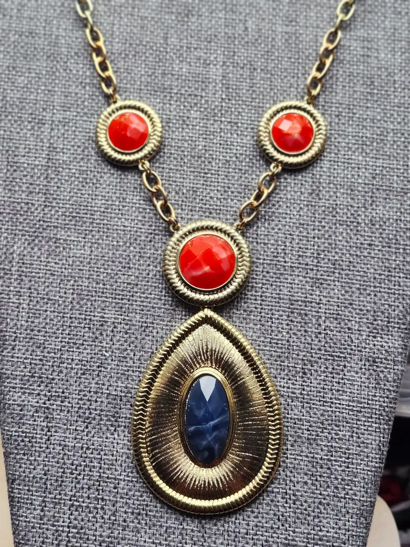 Gold and Red Necklace with Striking Pendant Design