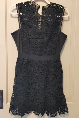 Dress- Brand: Romeo & Juliet Couture. Size Medium. NWT. Black lace dress. Material- 100% polyester. No callouts.