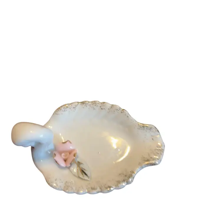 This is a vintage Napco porcelain swan trinket dish with a pink rose. - has been repaired