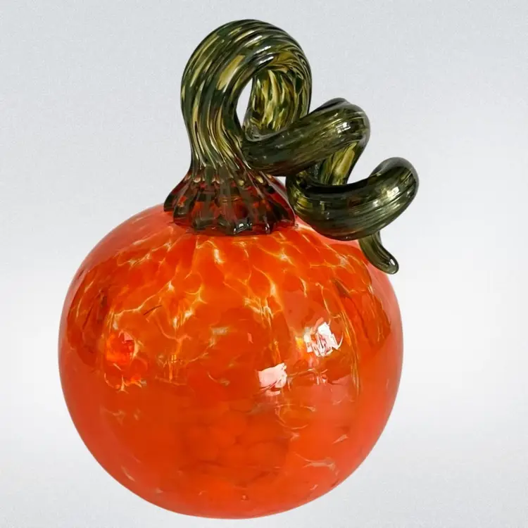 Handblown Glass Pumpkin – 4” Tall, 3”
Wide- Mottled Orange with Twisted Green Stem- UV Reactive