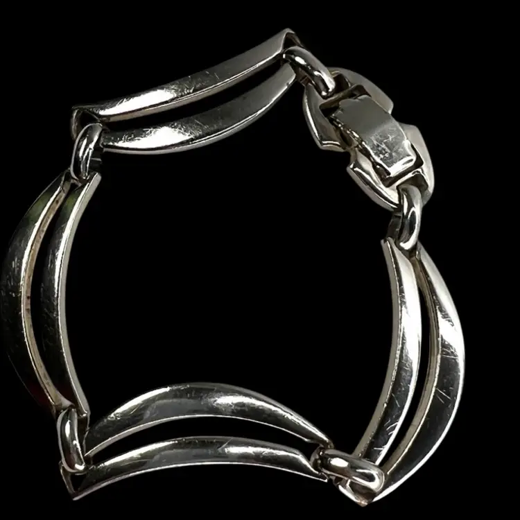 SPERRY mid-century silver-tone wave open link bracelet. Signed on clasp. Fits 7” Wrist.