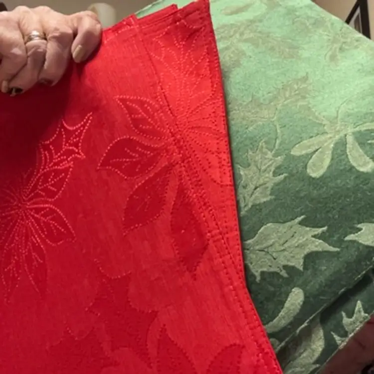 Four red and four green Christmas placemats