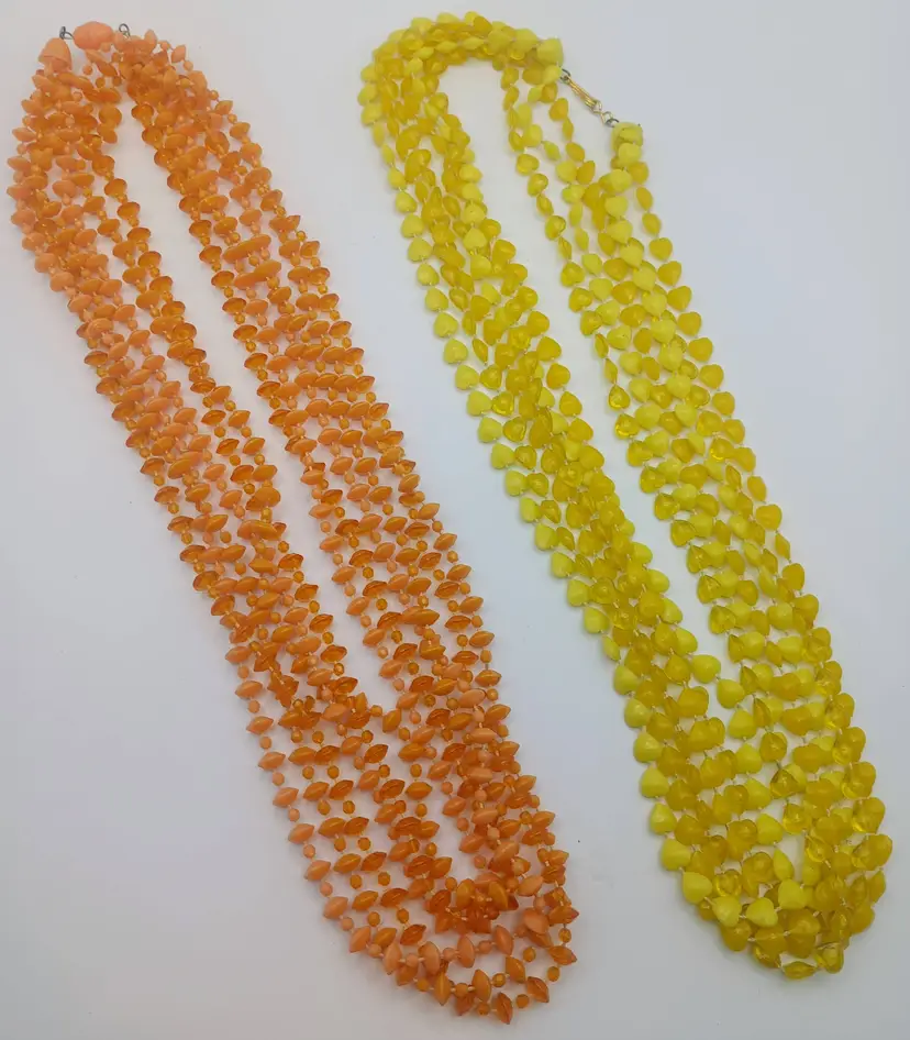 One Orange Rondel Beaded and One Yellow Heart Shaped Beaded Vintage Lucite Muti Strand Necklaces.