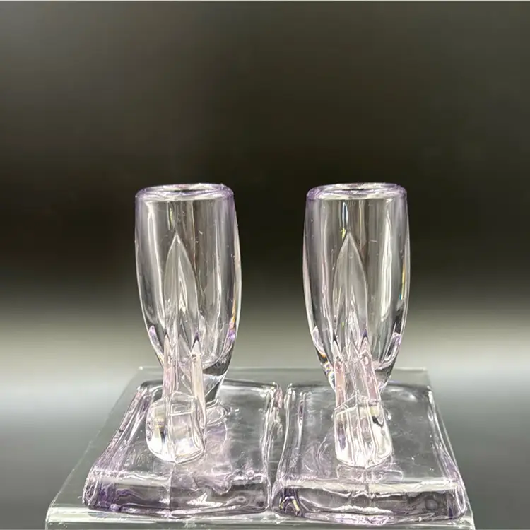 Art Deco American Glass Candle Holders and they have a few of lavender and color has some green glow with UV light