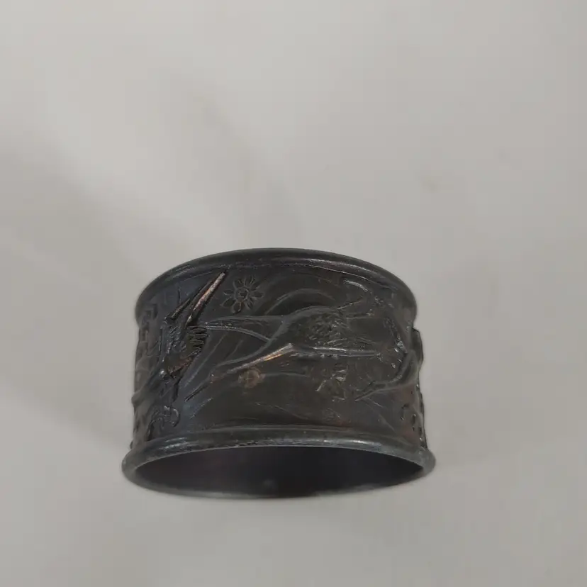 Victorian era Silver plated Napkin Ring. Features birds. Late 19th century.