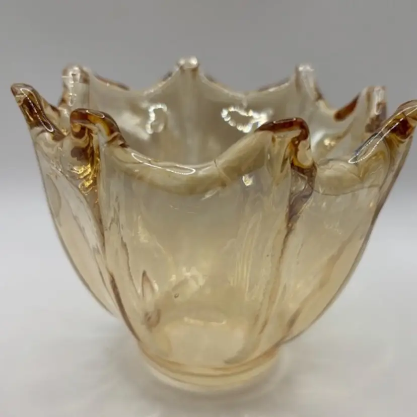 Hand-blown, gold-colored glass nut or fruit bowl. Italian or US production. pulled fingers. slight opalescence.