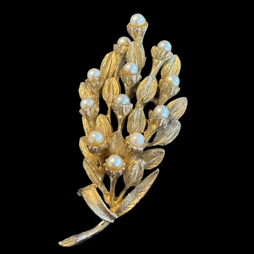 Vintage gold-tone Pamoli brooch with faux pearls in a floral design. 3” Wide
