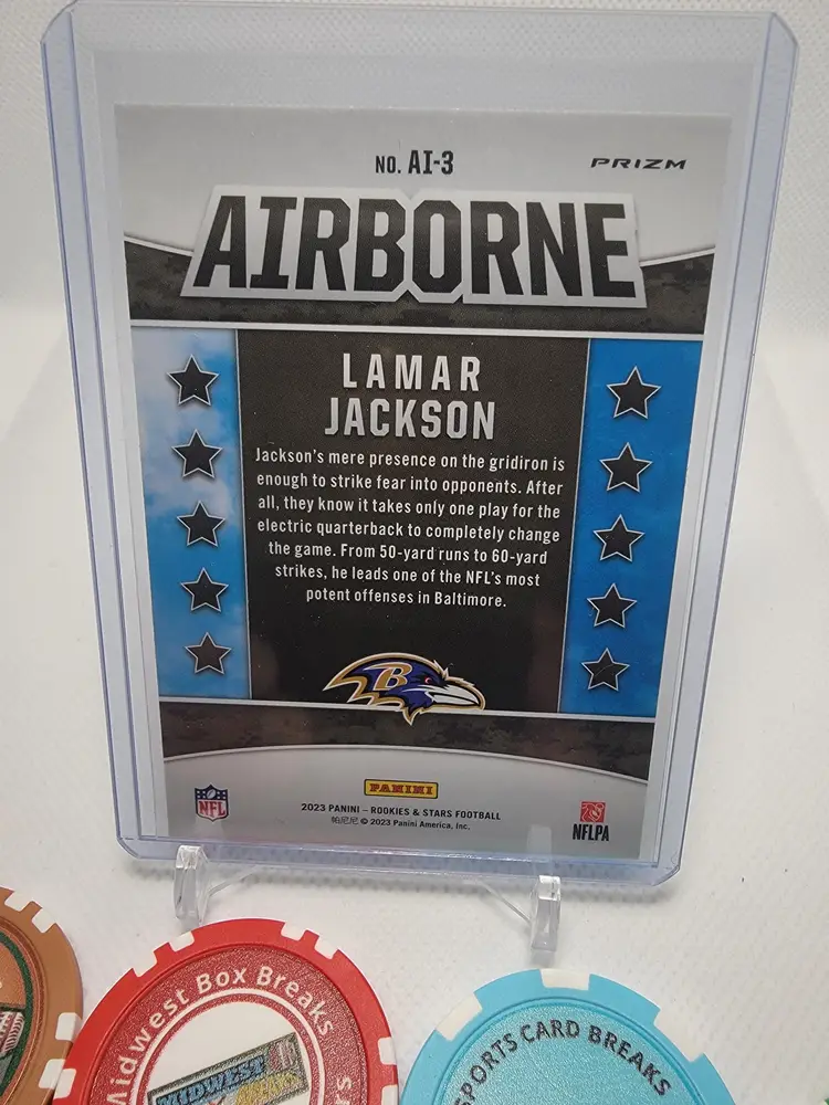 2023 Panini Rookies & Stars Lamar Jackson AI-3 Red Prizm Airborne Lazer - Baltimore Ravens
