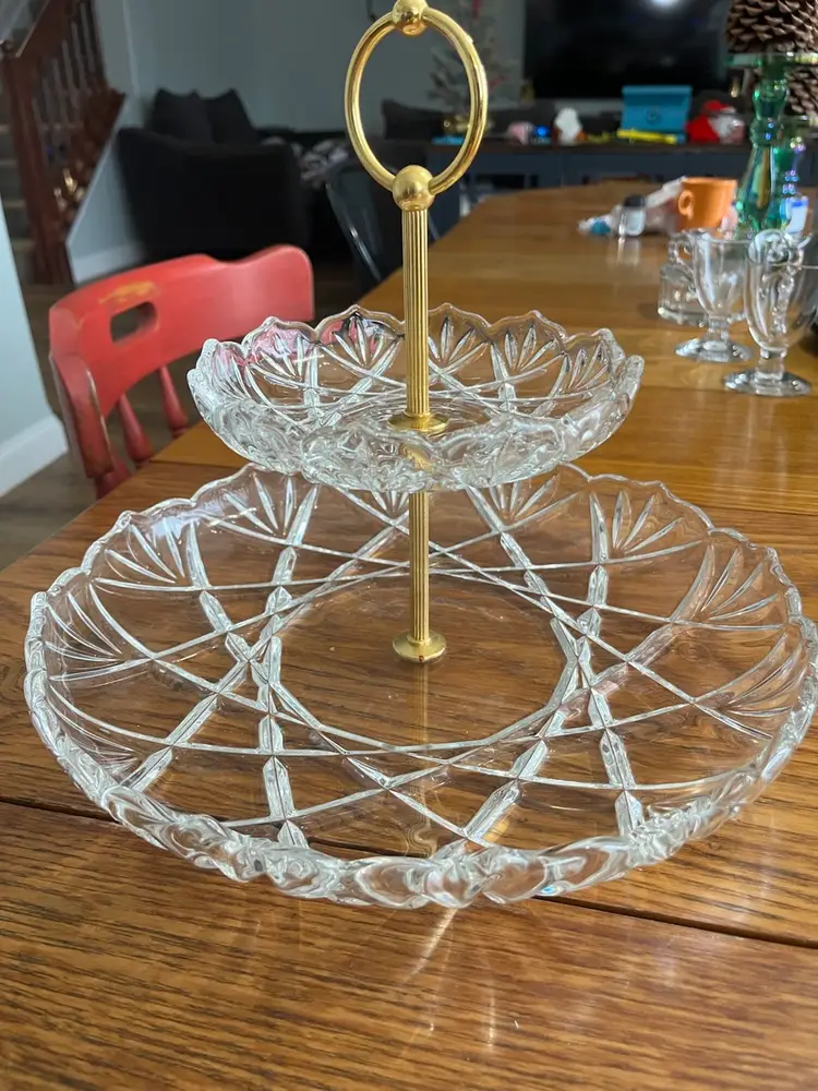 Vintage  Made in Germany Mikasa Roxborough 2 Tier Center Handle TidBit Tray Plate
Bottom Plate is 12 3/4" in Diameter.
Top Plate is 6 1/2" in Diameter.
9 1/8" Tall Overall. 
two-tier glass tidbit tray with a gold-toned handle.