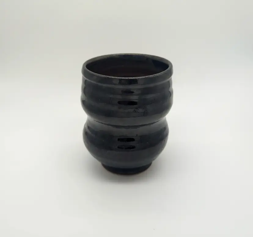 Black studio pottery handleless mug signed