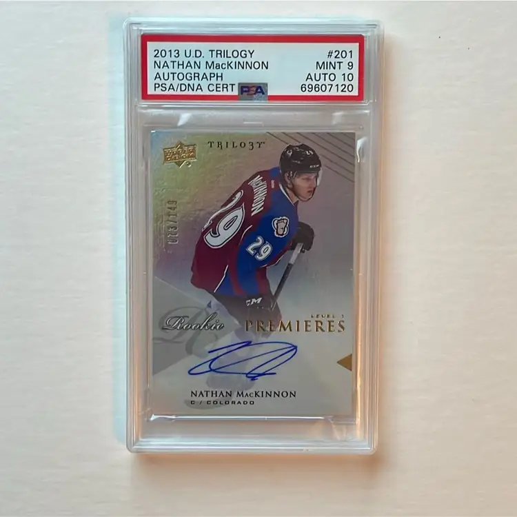Nathan Mackinnon UD Trilogy RC Auto /149.   Graded PSA 9 / 10 Auto Colorado Avalanche