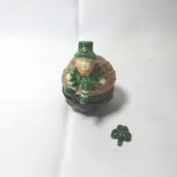 Porcelain Leprechaun on Pot of Gold Hinged Trinket Box w/ Shamrock Trinket