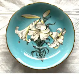 #01 Paragon “Easter Lily” England.  Saucer.  Turquoise Blue With White Lily Flowers. Flaw. As Is.
