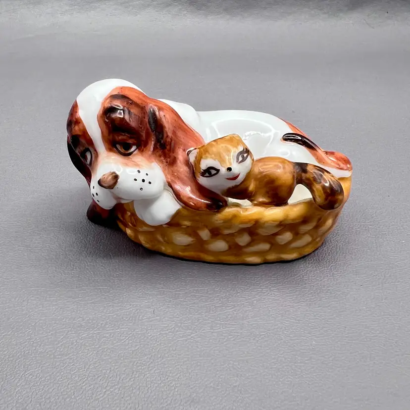 Vintage Napcoware Bone China Hound Dog With Racoon In Basket Figurine w Tag 3.75"X1.25"