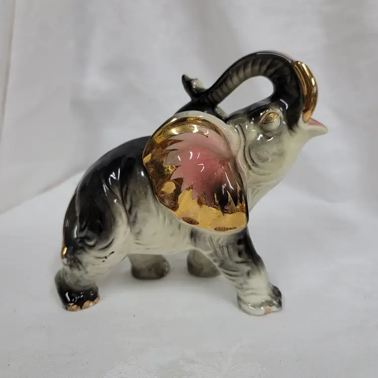 Trunk up elephant figurine with gold detail