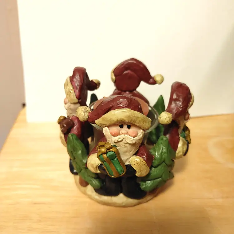 Santa candle holder. Each santa is different. No condition issues.