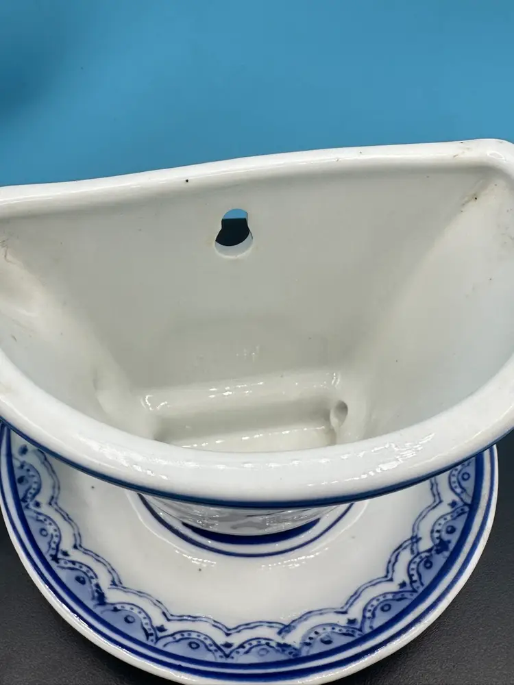 Vintage blue and white cup and saucer porcelain/ceramic wall pocket