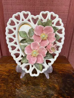 Ceramic, Reticulated, White Heart With Heart Border. Decorated With 3 Flowers And Leaves In A Capodimonte-style. Flowers Have Spaghetti-style Interiors.