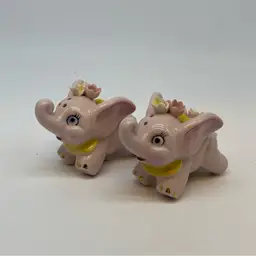 #2002 pair of vintage pink ceramic elephant salt and pepper shakers with cork stoppers.
