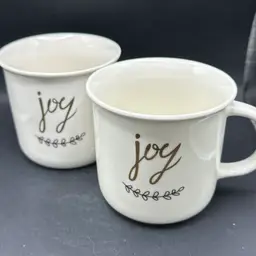 (2) SLEIGH BELL BISTRO Gold "Joy" Christmas Holiday COFFEE MUGS Beautiful Design