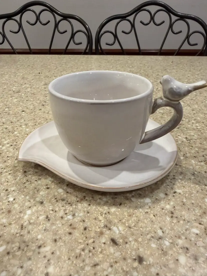 World market tea cup with bird and a saucer