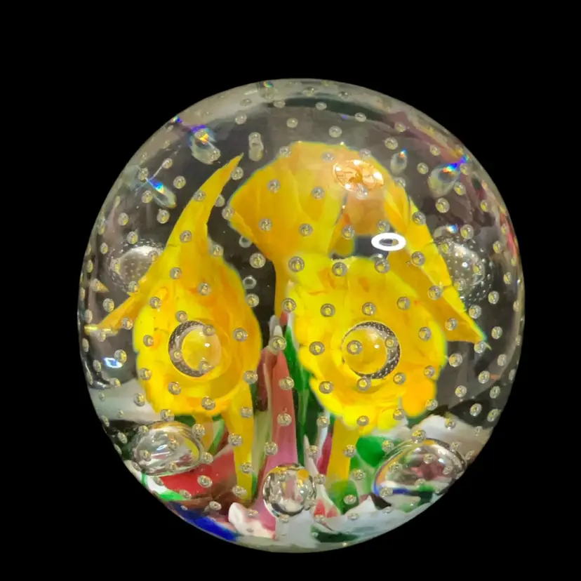 Handmade St. Clair art glass paperweight with yellow floral inclusions and Controlled  bubbles. Stamped Bottom