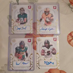 Lot of 21 college football cards. 4 auto's, 1 #'d, +. Letters M N O.