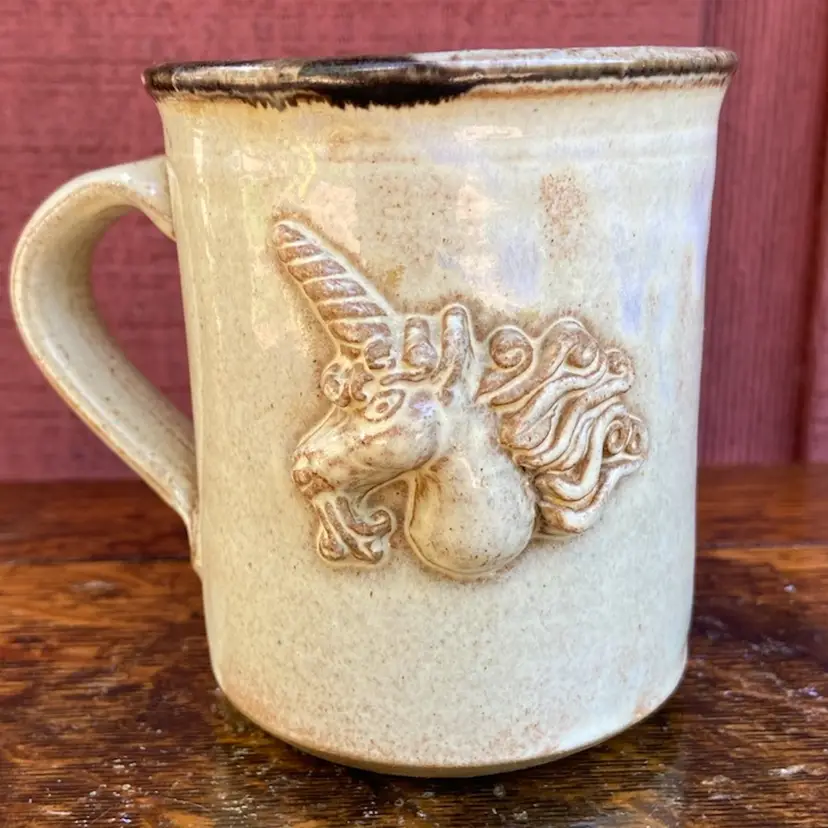 Studio Pottery Unicorn Mug. 4.25”h & 16 Ounces. Artist Signed “CM”.
