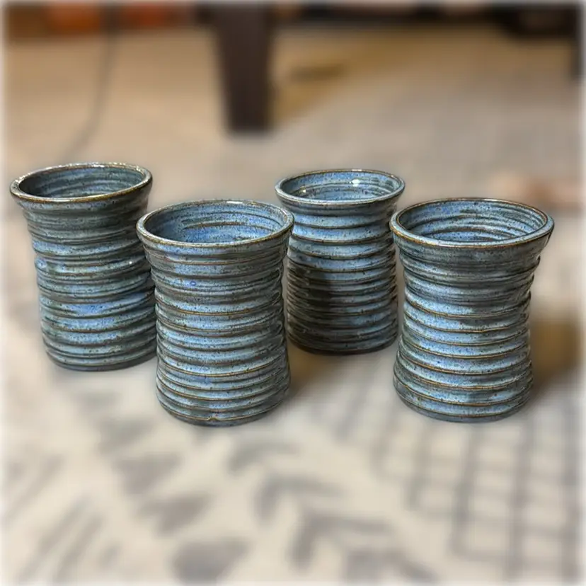 Set of Four Signed Studio Pottery Cups Signed JB - each cup is ~4.5” tall and ~3.5” in diameter
