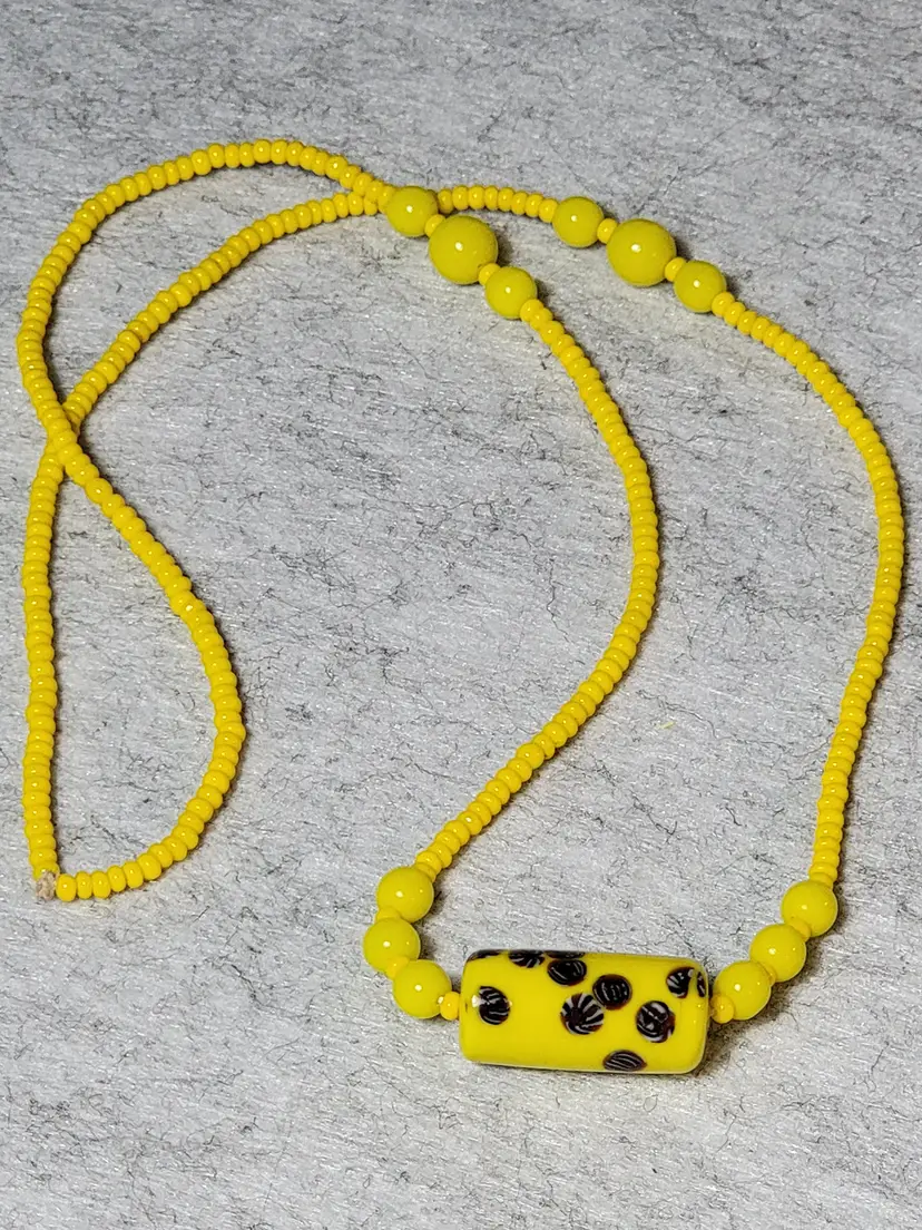 Bright yellow millefiori bead center and seed bead necklace