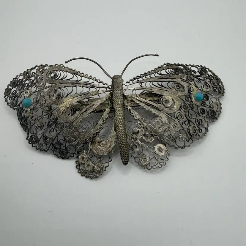 Early 20th Century Sterling Silver Filigree Butterfly Brooch with Turquoise Cabochons