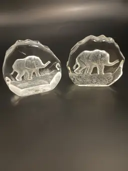 Two Glass Elephant Paperweights. One is The Swan Collection and One is The Royal Crown Collection.