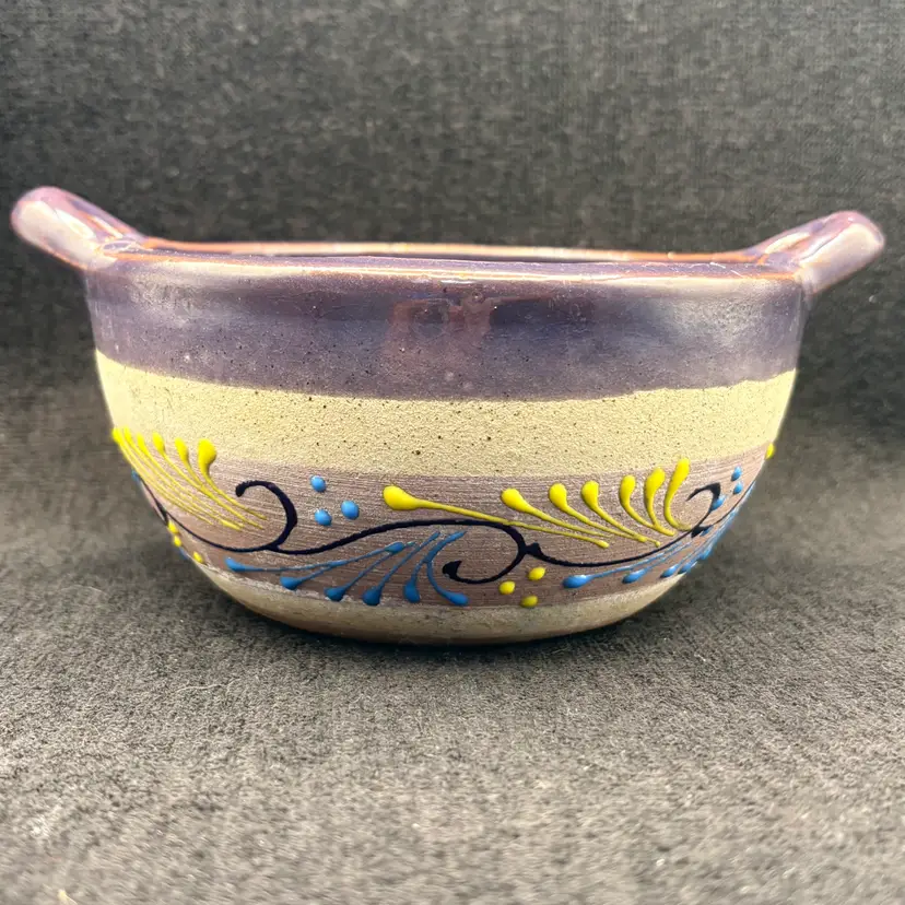 Handmade Mexican earthenware serving bowl with handles and hand-painted feather-like decorations