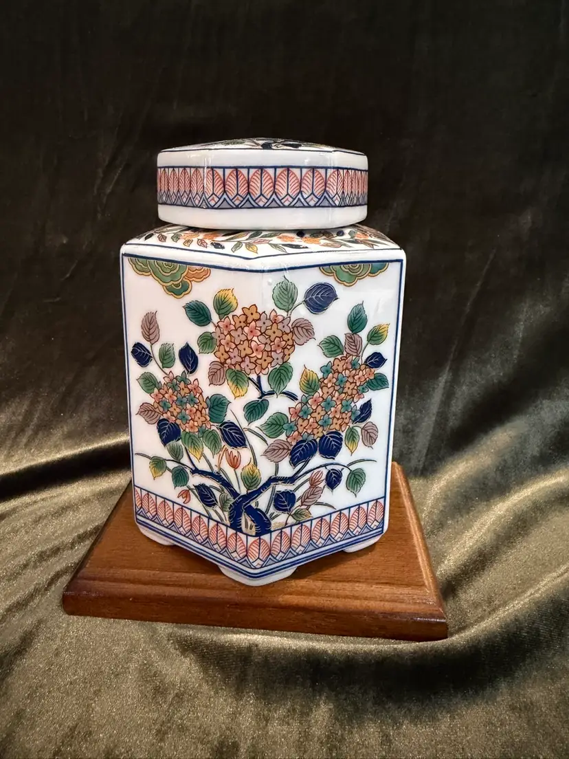 Vintage Japanese hexagonal ceramic tea canister with floral decoration.