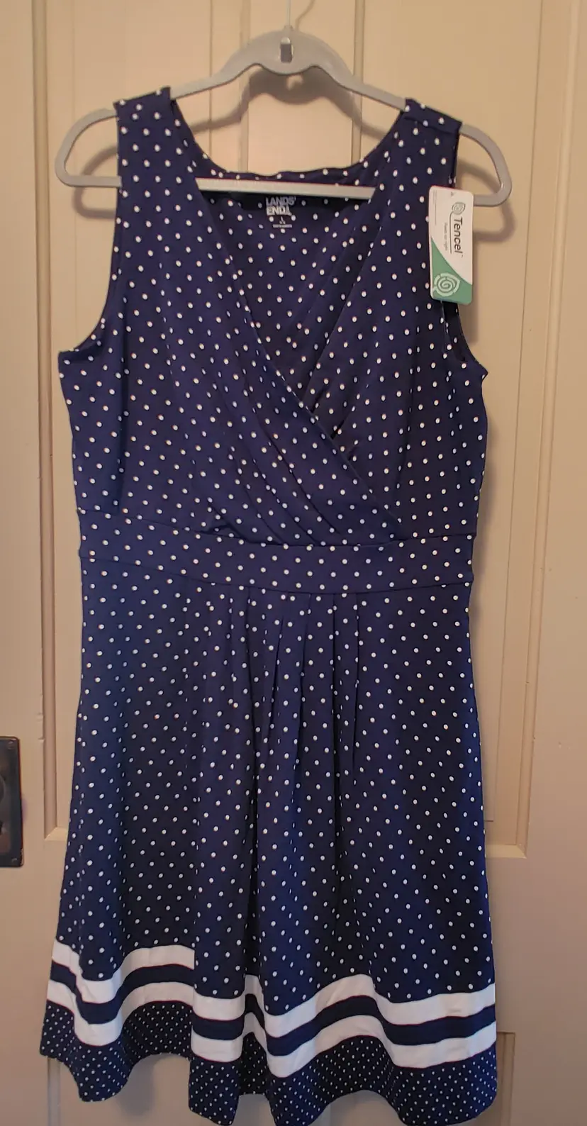 Dress- Brand: Land's End. Size 14-16. NWT. Blue with white polka dots dress. Material: 58% cotton, 38% modal, 4% spandex. No callouts.