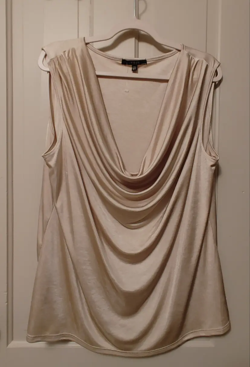 Top- Brand: Cyrus. Size 2X. Sleeveless champagne colored top. 100% polyester. No callouts.