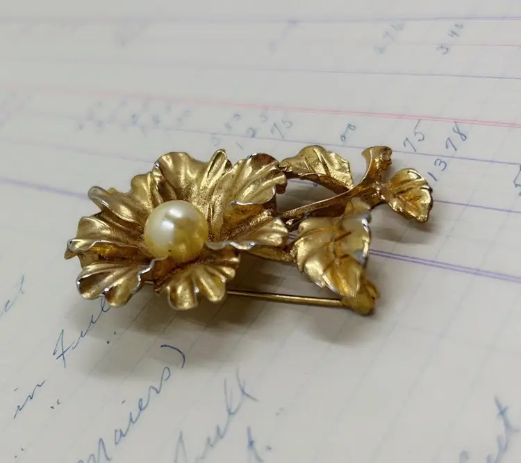 Gold tone Flower Pin With Pearl Type Bead In Center.