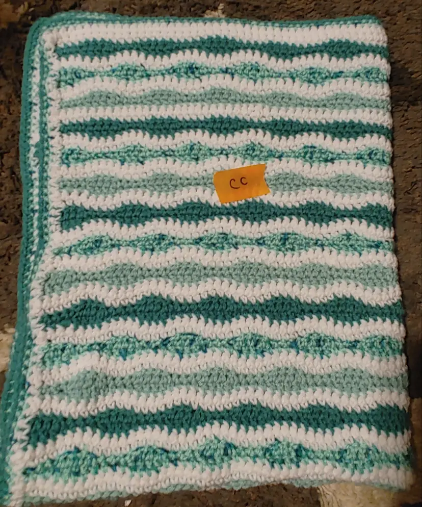 Afghan CC- approx size 32 x 42. Green stripe. As shown.