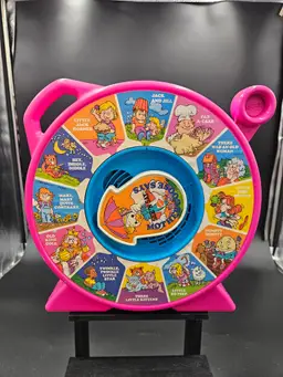 Vintage 1989 Mattel Pink Mother Goose Nursery Rhymes SEE AND SAY with lever and working speaker.