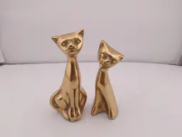 Pair of brass MCM cats