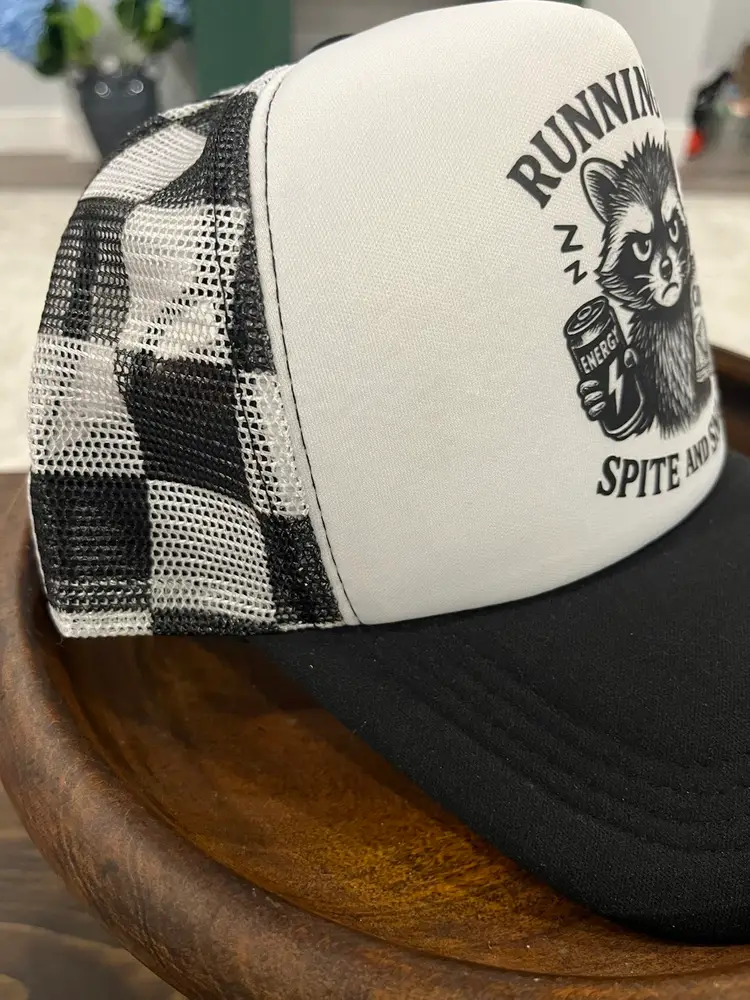 Running on Spite And Snacks Raccoon Trucker Hat