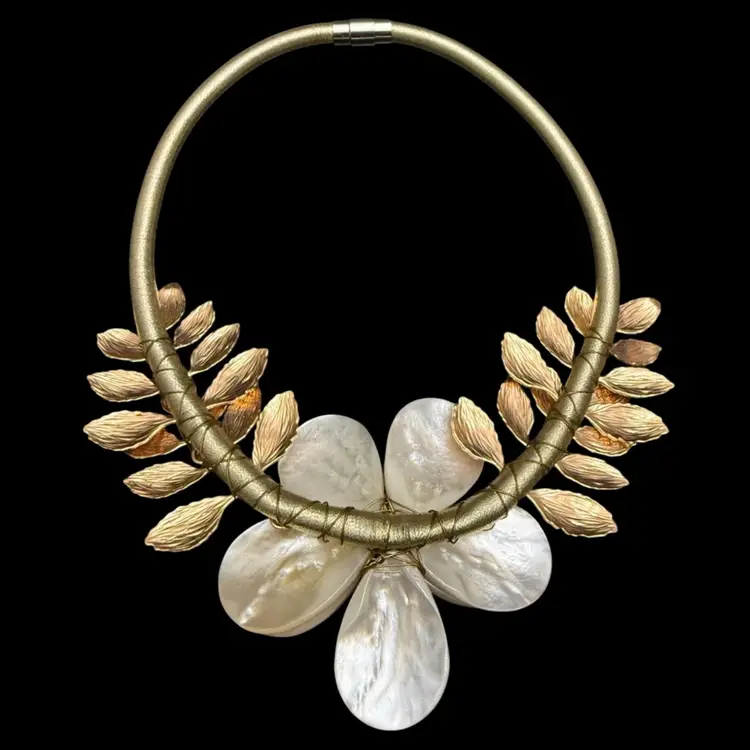 Ana Capri necklace featuring a mother of pearl floral design and gold-toned leaves