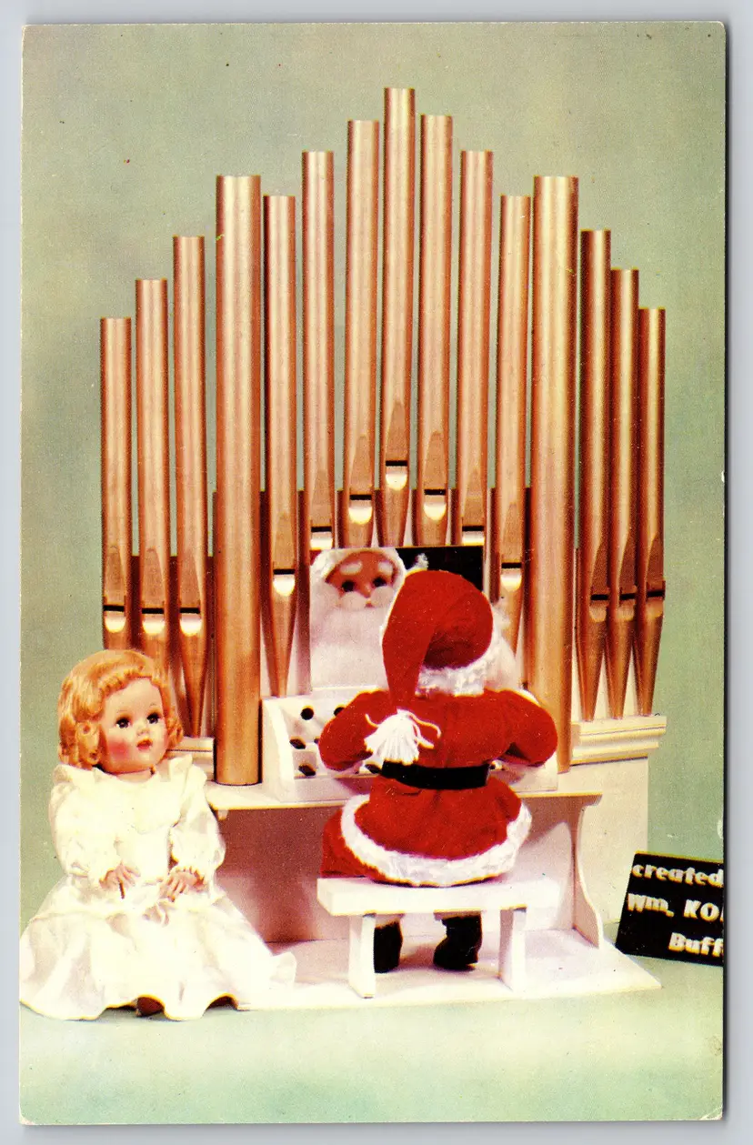 Postcard Christmas Organs Santa Doll William Korn and Company Buffalo New York